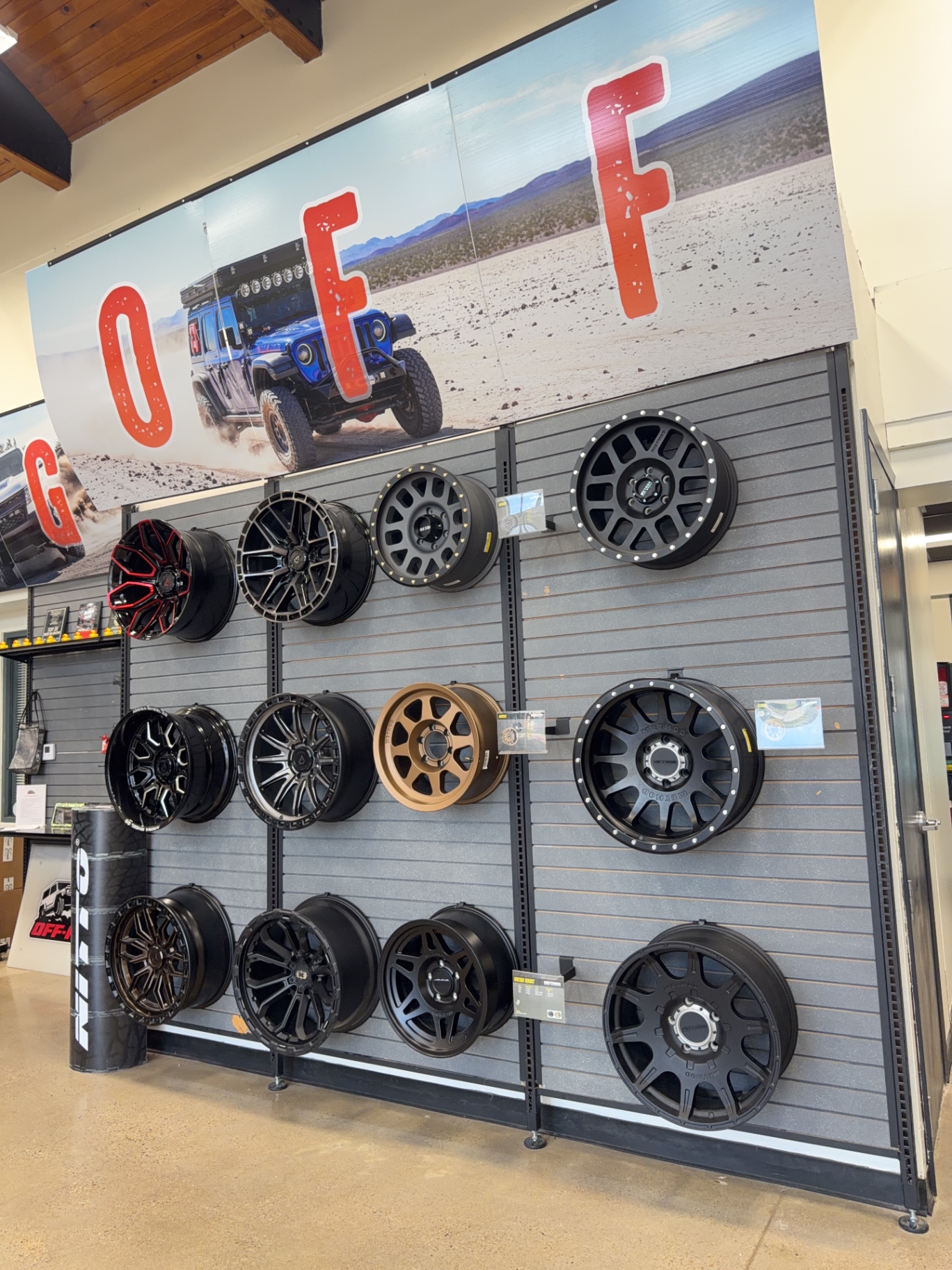Wall display of off-road wheels for trucks and Jeeps at RGV Off-Road McAllen, including Method, Fuel and KMC styles